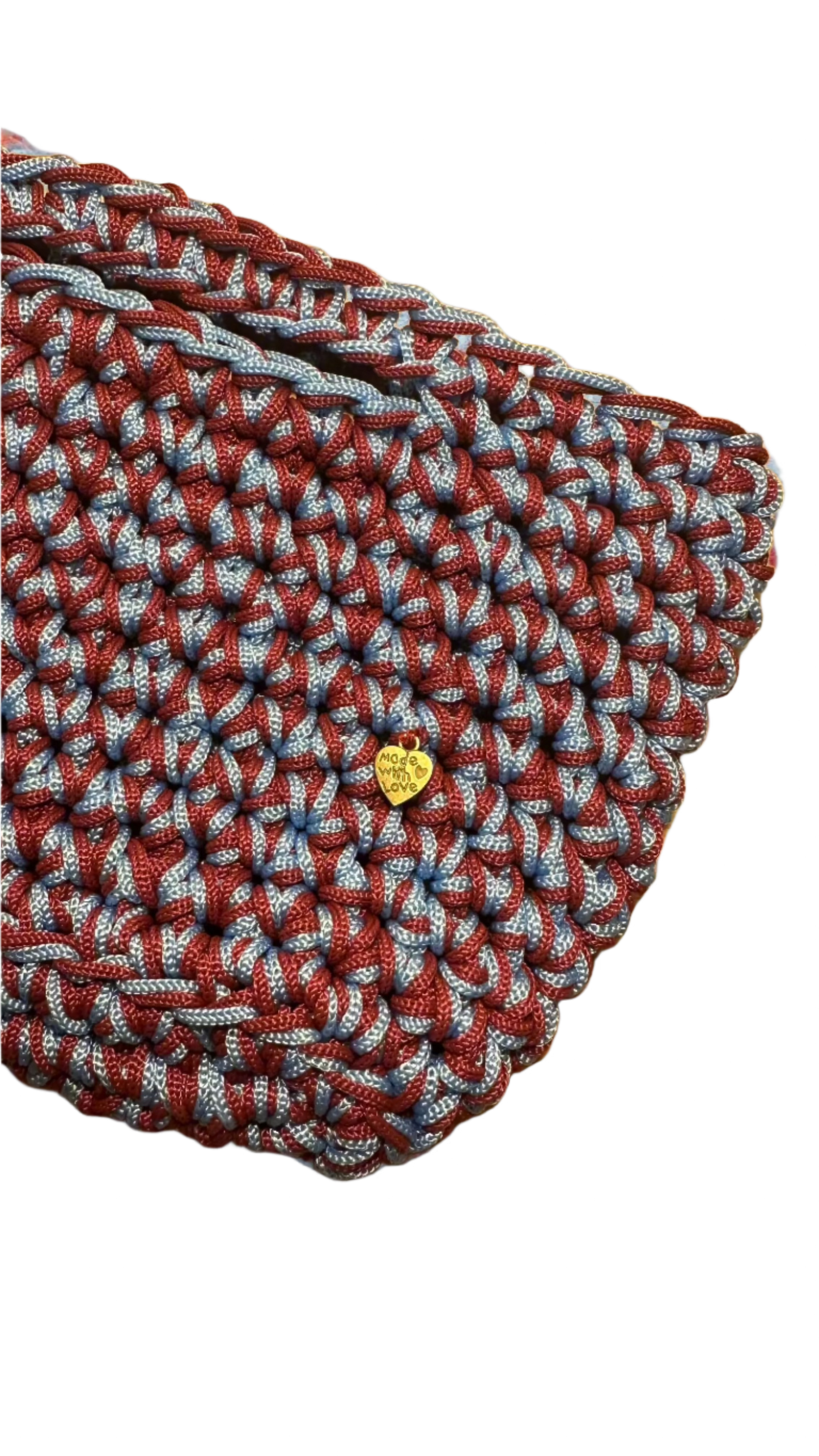 <img ="creaturina_bag.png" alt="Gennarina mini bag celeste e rosso mosto"