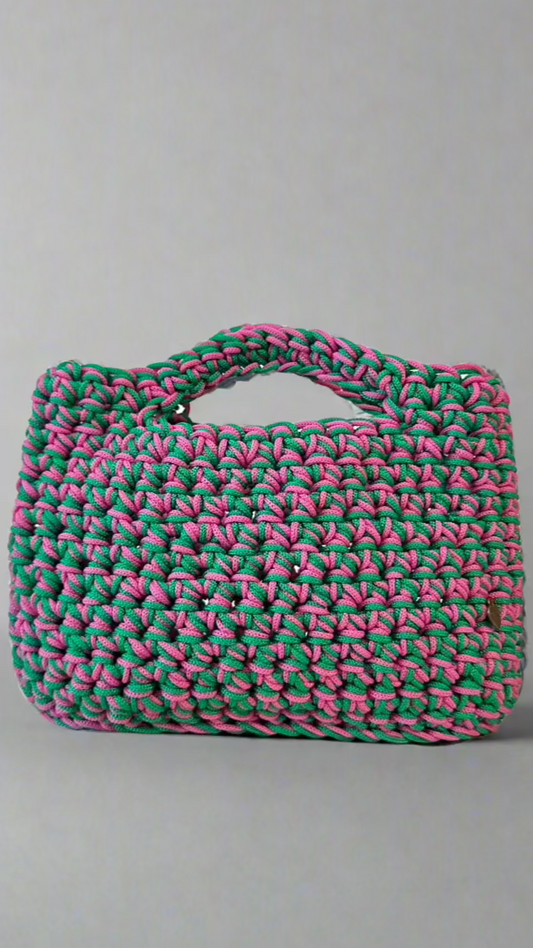 <img ="creaturina_bag.png" alt="Maggina mini bag rosa e verde">